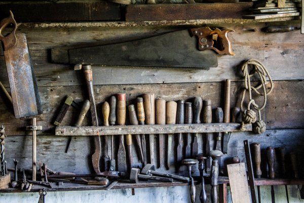 tools hung up in a woodworking shed